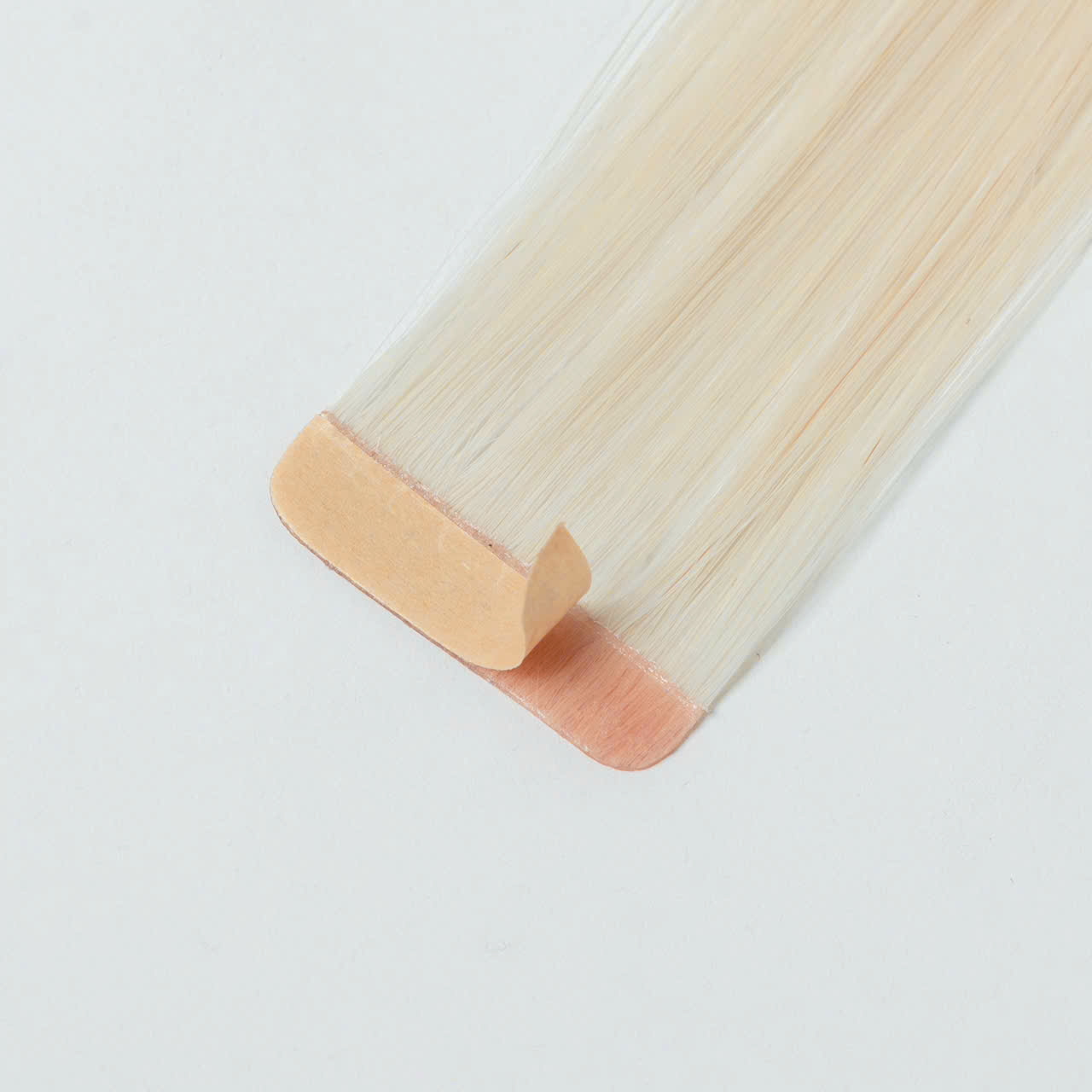 tape-in-hair-extensions-tab-close-up